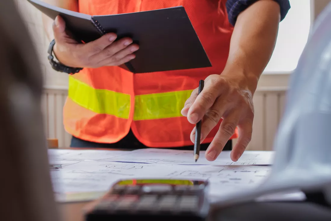 midsection-engineers-working-office